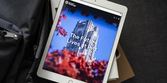 iPad showing the words "The Future Lives at Pitt".